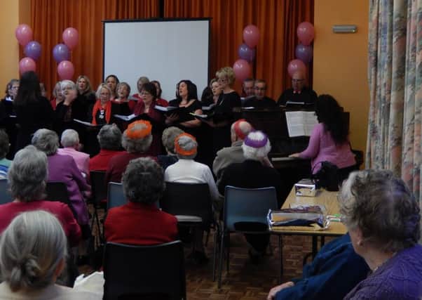 Guests are entertained by the choir at the annual Misterton senior citizens party