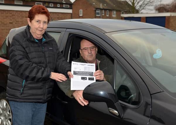 Bilsthorpe couple Angela and David Burditt were fined at St Peter's Retail Park when they were unable to get out of the car park because of traffic