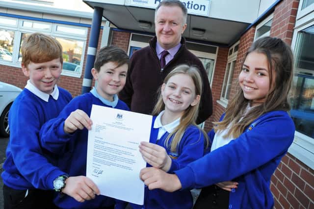 Pupils from Norbridge Academy show off the letter from the Minister of State for Schools which praised the Stanley Street school for it's progress in key stage 2, they are pictured with head teacher George Huthart and are from left, Murrey Simmen, Owen Myatt, Hannah Butler and Alysha Linacre.