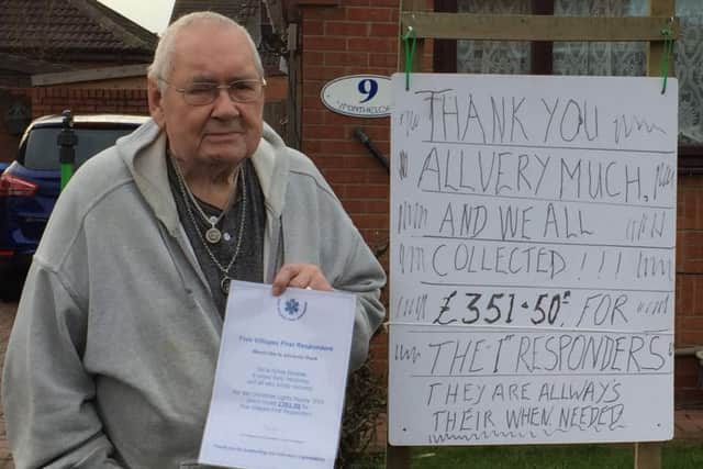 Sid Burgess with his certificate from the Five Villages Responders and his own thank you sign outside his house
