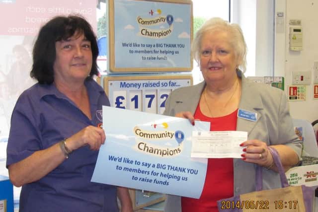 Carol Andrews from the Co-op and Brenda Allen, current chairman of fund.