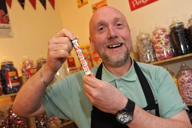 Dave Edwards of Edwards Emporium with a tube of lovehearts.