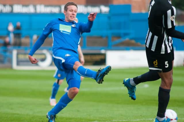 Darryn Stamp of Gainsborough Trinity having a shot