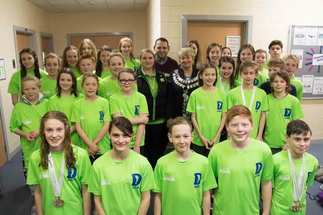 Worksop Dolphins swimming team have received funding from Asda towards their kit