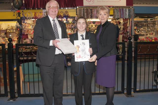 Crowle teenager Jade receives prize for her market meerkat creation