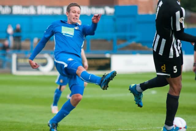 Darryn Stamp of Gainsborough Trinity having a shot