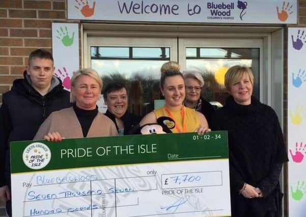 Presentation fo Prid eof Isle funds to Bluebell Wood Hospice