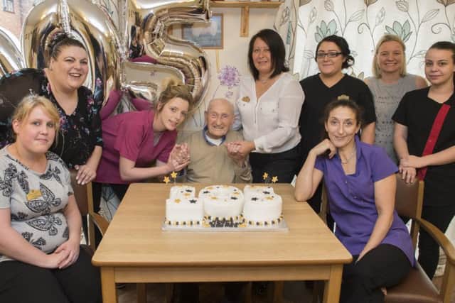 George Arnold celebrates his 105th birthday with staff at the Victoria Care Home in Worksop