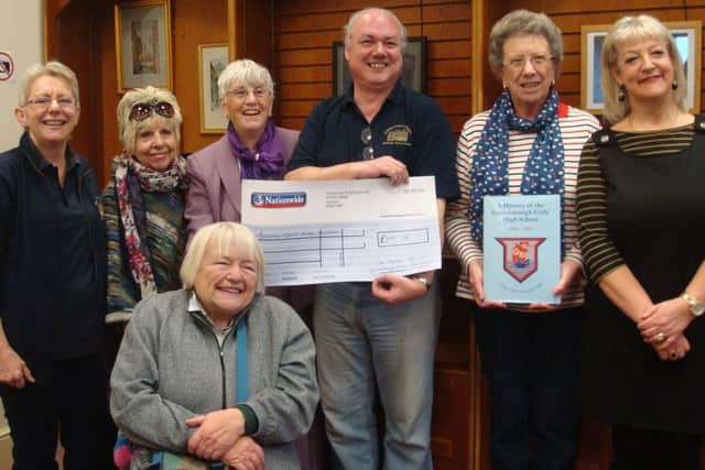 The Friends of the Gainsborough Girls High School presenting a cheque of Â£691.26 to the Chairman of the Gainsborough and District Heritage Association