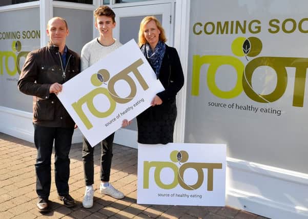 Michael and Mette with Jonathan and the new Root branding outside the Marshalls Yard store