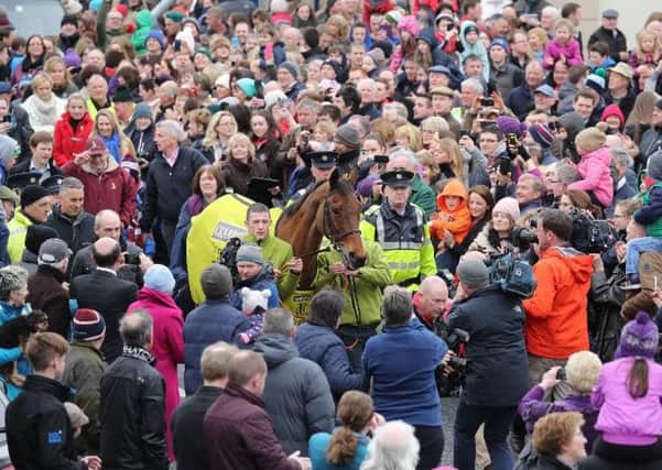 A HERO'S RETURN -- Crabbie's Grand National winner Rule The World is given a rousing reception as he returns to Mullingar in Ireland, the home town of owner Michael O'Leary.
