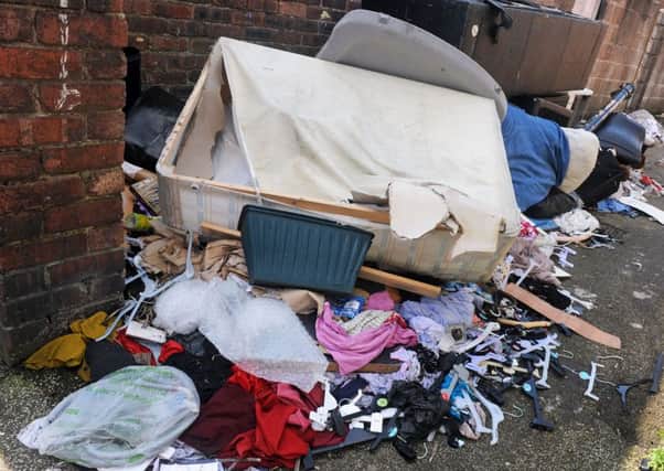 Fly-tipping mess to the rear of properties on Victoria Street, Mansfield, for which the Council  want the residents to pay for clear-up.