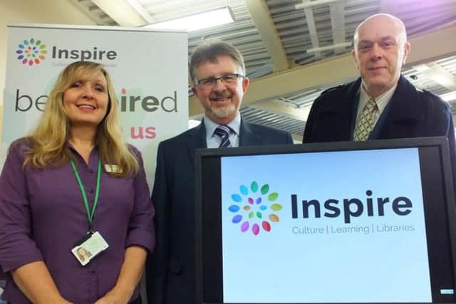 Library assistant Denise Hall, Nottinghamshire County Council Leader Councillor Alan Rhodes and Councillor John Knight.