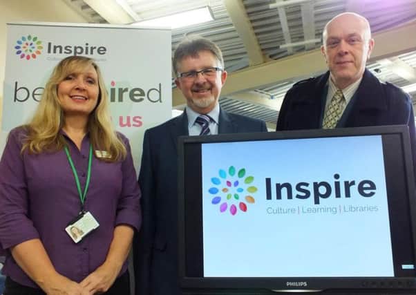 Library assistant Denise Hall, Nottinghamshire County Council Leader Councillor Alan Rhodes and Councillor John Knight.