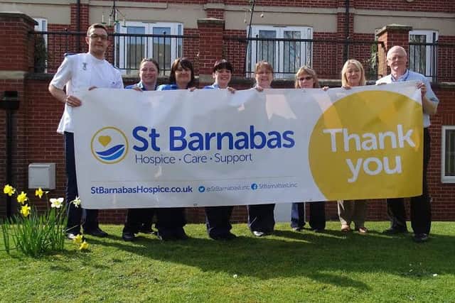 St Barnabas Hospice has undertaken a rebrand to better engage the local community with its services and fundraising efforts, staff are seen here displaying the charity's new logo.