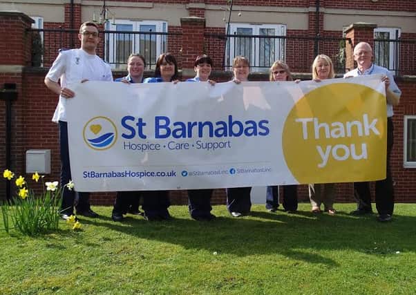 St Barnabas Hospice has undertaken a rebrand to better engage the local community with its services and fundraising efforts, staff are seen here displaying the charity's new logo.
