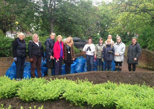 Staff at Browns working on Whittons Gardens.