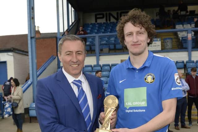 Jake Picton receives the Gainsborough Standard Readers Player of the Year trophy from chairman Richard Kane
Picture: Sarah Washbourn
