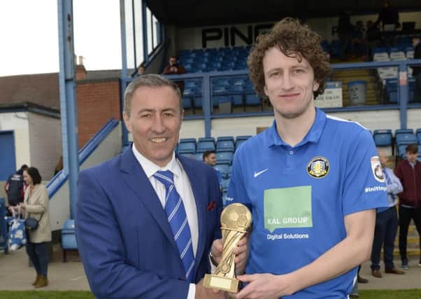 Jake Picton receives the Gainsborough Standard Readers Player of the Year trophy from chairman Richard KanePicture: Sarah Washbourn