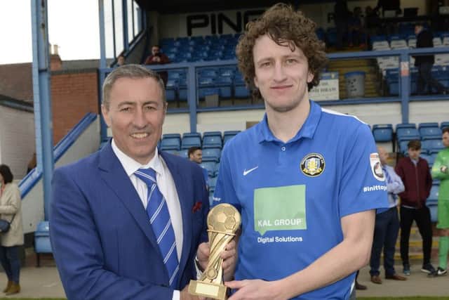 Jake Picton receives the Gainsborough Standard Readers Player of the Year trophy from chairman Richard Kane
Picture: Sarah Washbourn