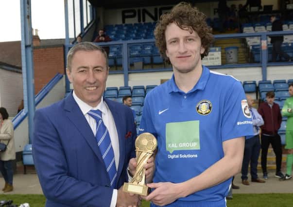 Jake Picton receives the Gainsborough Standard Readers Player of the Year trophy from chairman Richard Kane

Picture: Sarah Washbourn