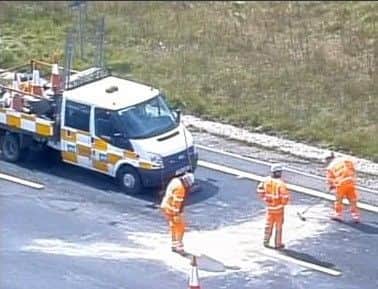 Highways England clears up after a collision on the M1 between J29 and J29A.