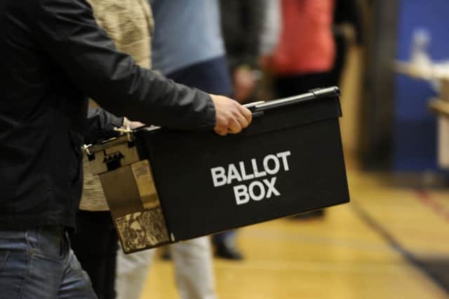 Ballot boxes are carried into the hall at the Richard Dunn Centre, Bradford,  for counting in the 2015 General Election.  7 May 2015.  Picture Bruce Rollinson