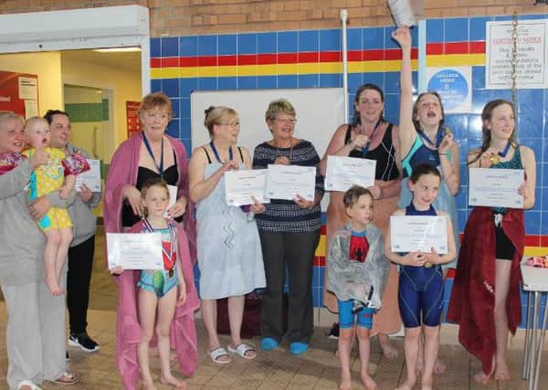 Swimmers with their certificates.