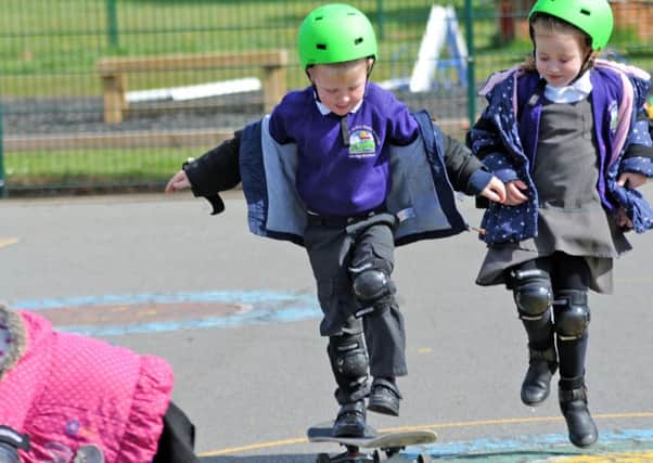 Hillcrest Early Years Academy skateboard session.Pupils from Miss Cotton's reception show off their skills on a skateboard.