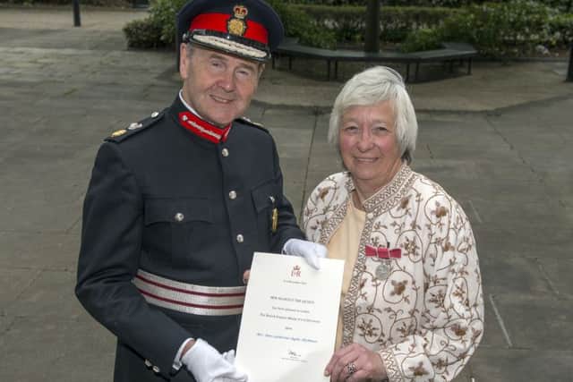 Ann Hickman receives the British Empire Medal from Sir John Peace, Lord-Lieutenant of Nottinghamshire at Nottinghamâ¬"s County Hall
Picture: Sarah Washbourn