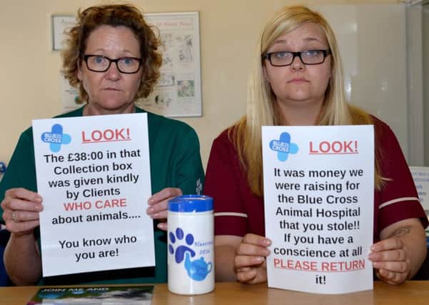 Thieves broke into VetSavers, Worksop and stole the Blue Cross collection box, pictured are from left Suzhy Winfield and Alex Munchie