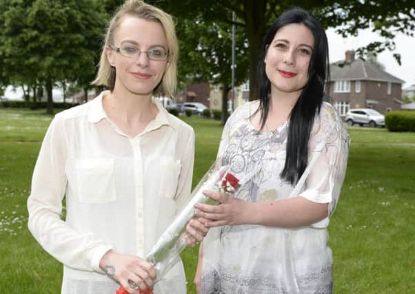 Rachel Wood receives a Worksop Guardian Rose from Victoria Cristofis, right  

Picture: Sarah Washbourn