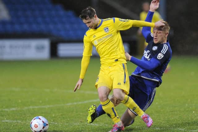 Gavin Rothery in action for Guiseley at Halifax Town last season. Photo by Bruce Rollinson.