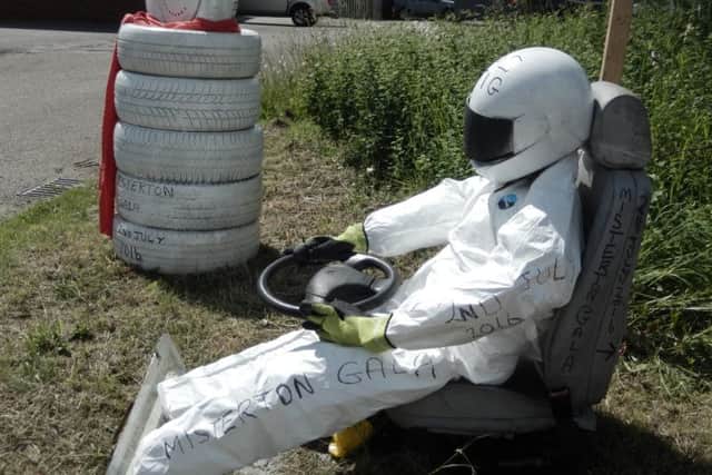 A Stig-Crow outside KSS Tyres in Misterton is part of the annual village gala's scarecrow competition