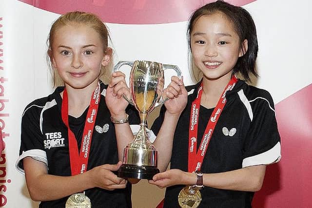 NATIONAL CHAMPIONS -- Darcie Proud, of the Blitz club in Gainsborough, and her playing partner, Ruby Chan, after their U13 doubles triumph. (PHOTO BY: Steve Parkin)