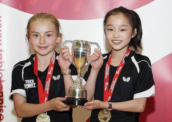 NATIONAL CHAMPIONS -- Darcie Proud, of the Blitz club in Gainsborough, and her playing partner, Ruby Chan, after their U13 doubles triumph. (PHOTO BY: Steve Parkin)