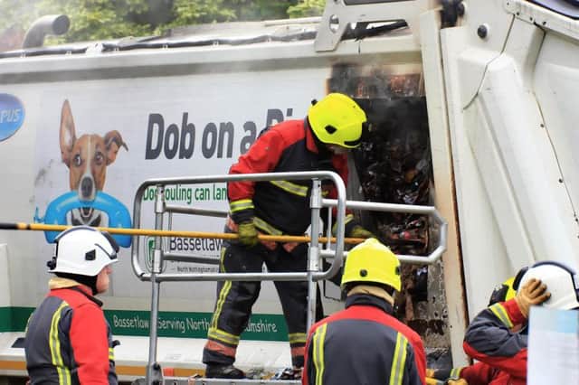The side of a bin lorry had to be cut open to tackled a fire