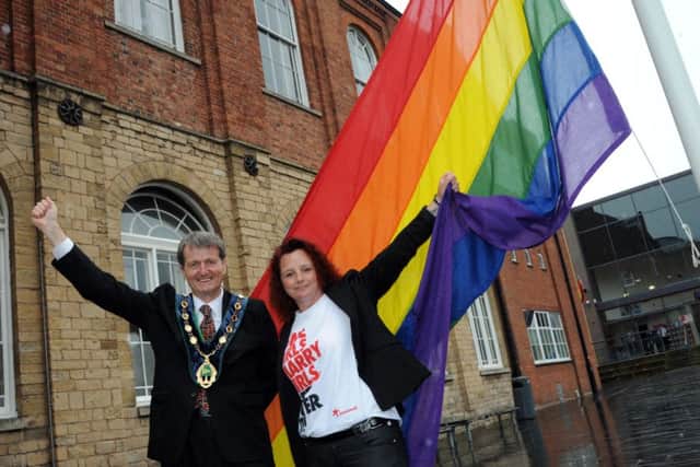 Bassetlaw District Council chairman, Coun. Jim Anderson and Worksop Pride organiser, Crystal Lucas pictured at the LGBT flag raising ceremony in Worksop on Wednesday.