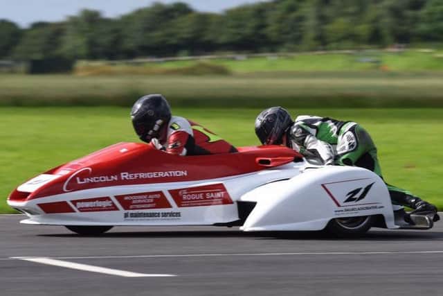 FLYING TO VICTORY -- the Nev Jones sidecar team.