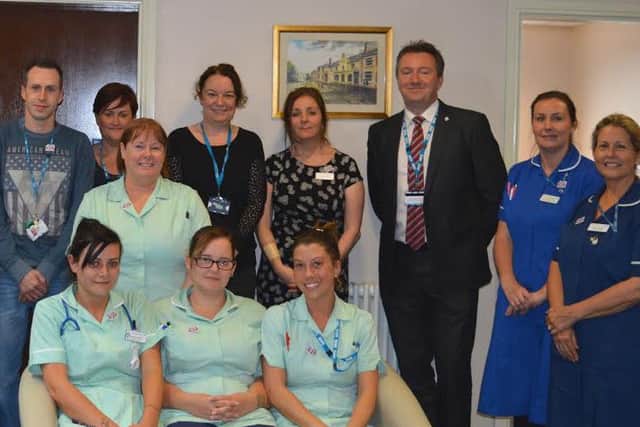 Health Care Assistants and the Skin Integrity team with Rick Dickinson, Deputy Director of Quality and Governance (third right) and Mike Oldfield, Health Care Assistant is fifth left.