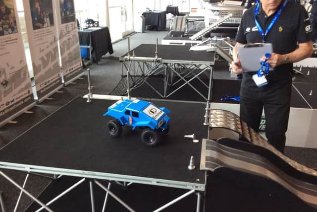 Demonstrating the car for the judges