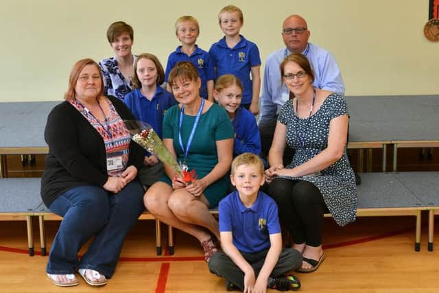 Guardian Rose presentation to Mrs Linda Foy, nomiated by Charlotte Lamb. Linda is pictured with Vicky Trendell, Charlotte Lamb, Sam Ferrol, children and St John's principal David White