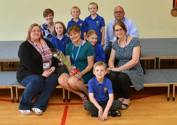 Guardian Rose presentation to Mrs Linda Foy, nomiated by Charlotte Lamb. Linda is pictured with Vicky Trendell, Charlotte Lamb, Sam Ferrol, children and St John's  principal David White