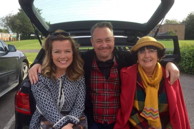 TV antiques experts Christina Trevanion and Nick Hall with presenter Anita Manning, waiting for filming to start