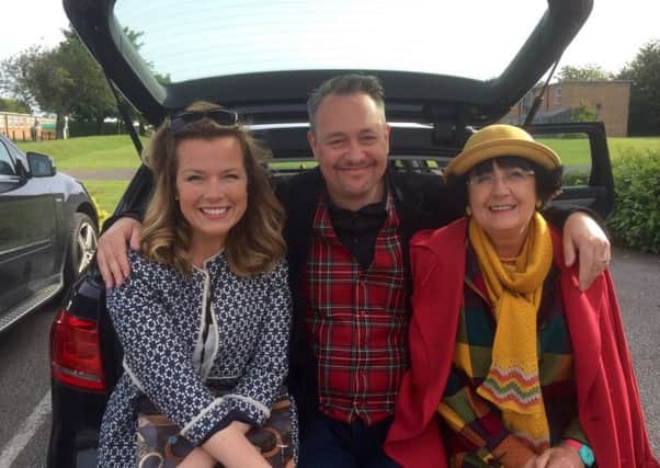 TV antiques experts Christina Trevanion and Nick Hall with presenter Anita Manning, waiting for filming to start