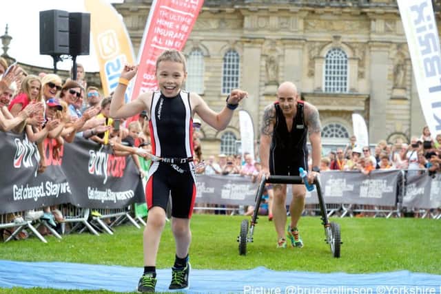 BBC Sport Personality of the Year winner, Bailey Matthews returns to the Castle Howard Triathlon, where he won the hearts of the nation last year by casting aside his walking frame to finish the race. Bailey is nine years old and has cerebral palsy. Helped by his dad Jono and Uncle John Hardcastle.
23 July 2016. Picture Bruce Rollinson