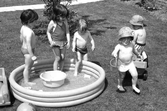 Youngsters taking a dip in the hot weather, 9 June 1976