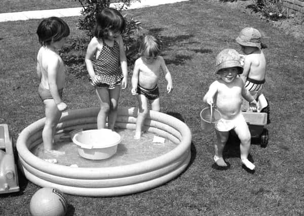 Youngsters taking a dip in the hot weather, 9 June 1976