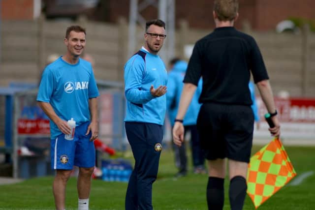 Gainsborough Trinity v Altrincham FC, pictured is manager Dom Roma and assistant Martin Foster questioning the linesmans decision