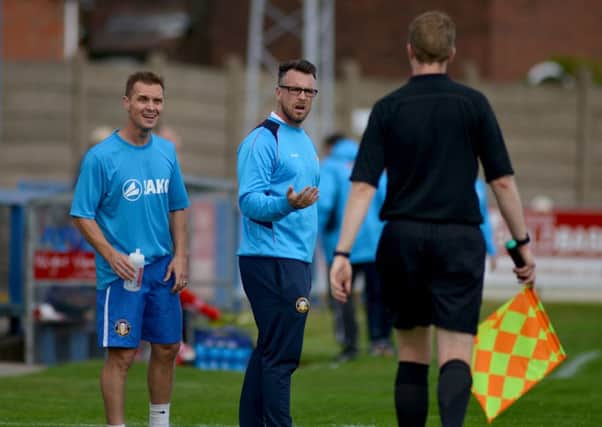 Gainsborough Trinity v Altrincham FC, pictured is manager Dom Roma and assistant Martin Foster questioning the linesmans decision